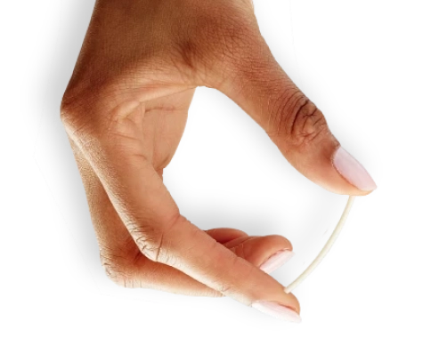 Hand Holding Implant Between Thumb and Index Finger to Show Relative Size of Implant